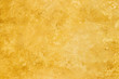 © Eugene_Photo - Texture of yellow decorative plaster.
