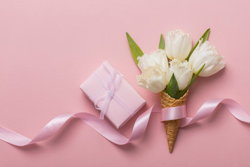 Wall Mural - Flat-lay waffle cone with white flower blossom