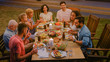 © Gorodenkoff - Group of Friends Gathered Together at the Table Relatives and Friends, Young and Elderly are Eating, Drinking, Passing Dishes, Joking and Having Fun. Garden Party Evening Celebration.