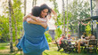 © Gorodenkoff - Beautiful Young GirlHugs Her Muscular Boyfriend. Two Young People Embrace in the Backyard of a Garden on a Hot Summer Day.