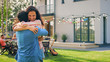 © Gorodenkoff - Beautiful Young Girl Hugs Her Boyfriend. Two Young People Embrace in the Backyard of a Garden on a Hot Summer Day.