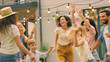 © Gorodenkoff - Family and Friends Dancing together at the Garden Party Celebration. Young and Elderly People Having Fun on a Sunny Summer Day Disco.