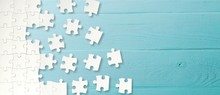 White Puzzle Pieces On Blue Background