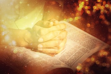 Woman Praying with Bible close up