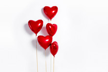 Set Of Air Balloons. Bunch Of Red Color Heart Shaped Foil Balloons Isolated On White Background. Love. Holiday Celebration. Valentine's Day Party Decoration. Metallic Red  Heart Air Balloons