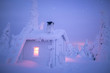 © Tiina Törmänen - Illuminated snow covered log cabin in forest at night during winter