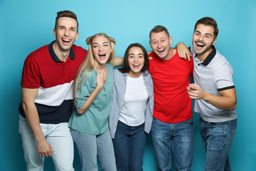 Poster - Group of friends laughing together against color background