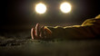 © motortion - Car headlighting unconscious victim, lying on road after accident, crime