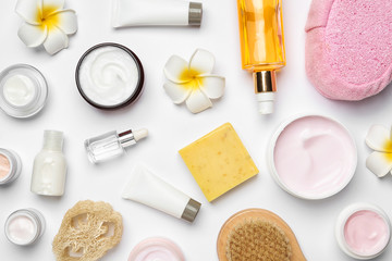 flat lay composition with body care products on white background