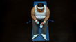 © motortion - Exhausted obese man holding bottle with water sitting on fitness mat, workout
