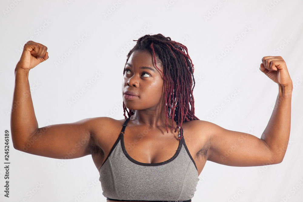 Strong Black woman flexing her muscle Stock Photo Adobe Stock
