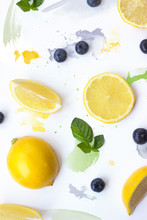 Lemon, Blueberries And Mint Leaves On White Background With Watercolor Strokes; Creative Summer Background