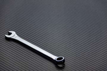 Silver wrench with the words 'chrome vanadium' on Carbon 6