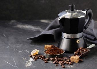 still life of coffee, grains and ground on a black background