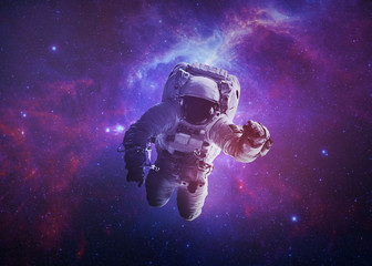 astronaut afloat - elements of this image furnished by nasa