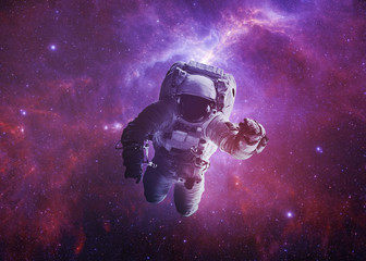 Wall Mural - astronaut afloat - elements of this image furnished by nasa
