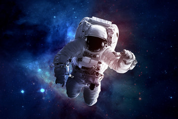 Wall Mural - astronaut afloat - elements of this image furnished by nasa
