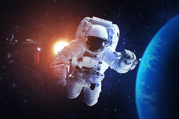 Wall Mural - astronaut afloat - elements of this image furnished by nasa