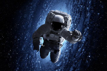Wall Mural - astronaut afloat - elements of this image furnished by nasa
