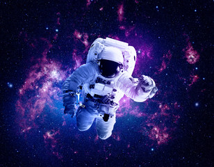 Wall Mural - astronaut afloat - elements of this image furnished by nasa