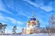 © vaalaa - Moscow city historical skyline white winter wonderland street view of orthodox church with colorful dome and golden cross  cold season landscape background russian winter scene