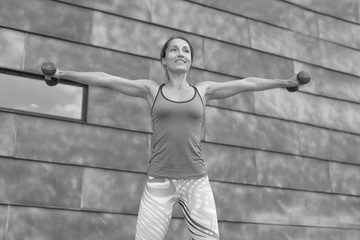 Wall Mural - strong athletic girl holds a workout