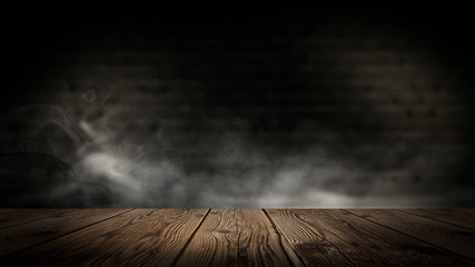 Wooden table in a dark room.