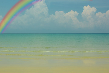 blue sea with blue sky with rainbow background