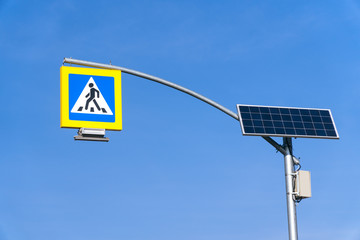 Wall Mural - street lighting, supports for ceilings with led lamps. concept of modernization and maintenance of lamps, place for text, day, road sign. crosswalk. a solar panel