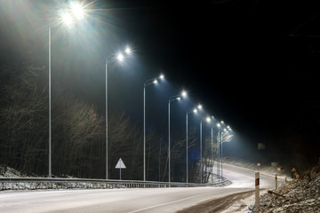 Wall Mural - street lighting, supports for ceilings with led lamps. concept of modernization and maintenance of lamps, place for text, night. winter season. energy-saving lamps, safety of movement