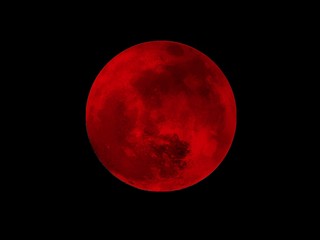 red moon illustration with black background