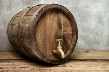 Poster - Wooden barrel with tap and worn old table of wood.
