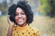© Igor Butseroga - Young dark-skinned woman dressed in casual clothes