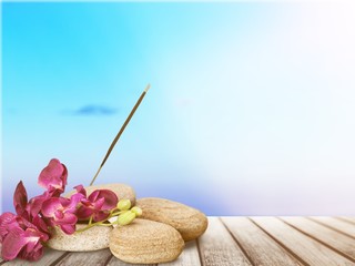 Poster - Zen basalt stones and flowers on white background