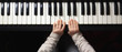 Children's hands learn to play the piano