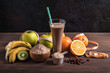 Chocolate protein shake with fruits and raisins on the wood table