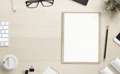 Poster - Blank paper on office desk with copy space beside. Office accessories beside.