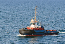 A Tugboat Navigates On The Sea