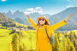 Happy Young woman travel in Dolomites mountains, Italy at autumn time