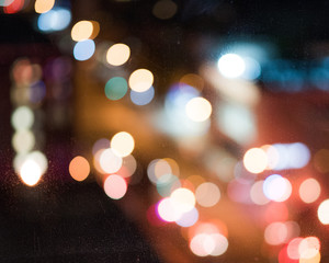 City lights bokeh at 4-alarm fire at nighttime in New York City