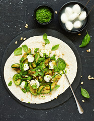 Sticker - Grilled zucchini, mozzarella and pesto salad on a tortilla cake. Snack. Selective focus.