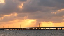 Dramatic Sunset With Orange Clouds Seascape In Bahia Honda State Park In Florida Keys, Old Seven Mile Bridge At Gulf Of Mexico 