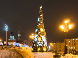 Wall Mural - Christmas tree and the Temple of the Kazan Icon of the Mother of God in Izhevsk. Russia