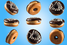 Chocolate Glazed Donut On Blue Background. High Resolution Image For Food Industry.