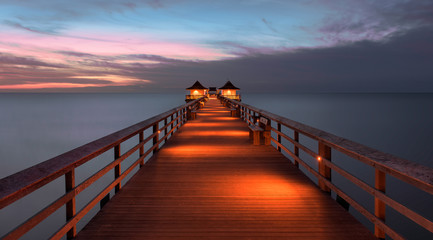 Fototapete - Sunset over the Gulf of Mexico from Naples Pier in Naples, Florida