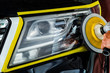 Car headlights with power buffer machine at service station - a series of CAR CARE