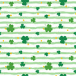 Saint Patrick's Day striped seamless pattern background with green clover, shamrock and dots.
