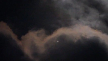Wall Mural - close up to jupiter and its moon covered by earth clouds taken with telescope in the dark space.
