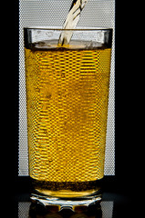 glass of beer on dark background,glass of cold beer on the table. object on a black background, а glass of beer, alcohol beverages, beer with foam  black background