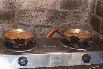 cooking of traditional african dishes in restaurant in south africa